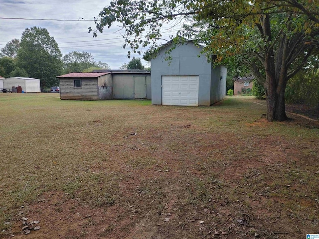 view of yard with a garage