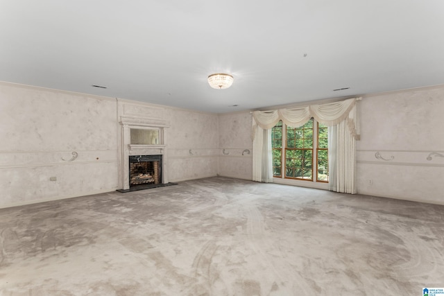 unfurnished living room featuring concrete floors