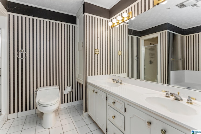 bathroom with toilet, tile patterned flooring, a shower with door, vanity, and a textured ceiling