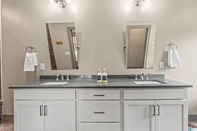 bathroom with vanity and wood-type flooring