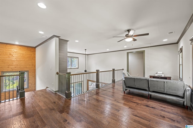 interior space featuring crown molding, a wealth of natural light, and hardwood / wood-style floors