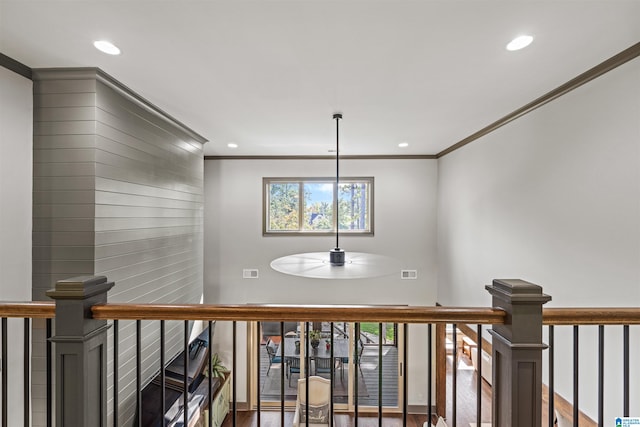 hall featuring crown molding and hardwood / wood-style flooring