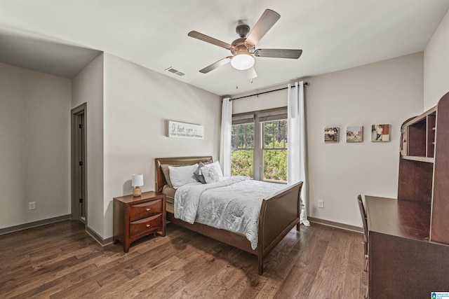 bedroom featuring ceiling fan and dark hardwood / wood-style floors