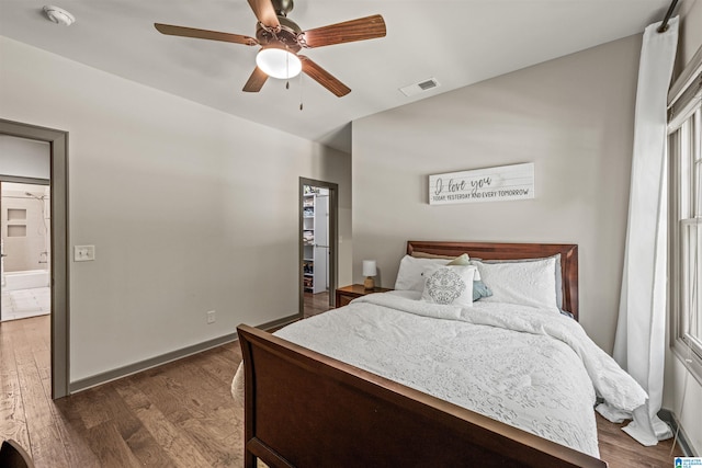 bedroom with dark wood-type flooring and ceiling fan