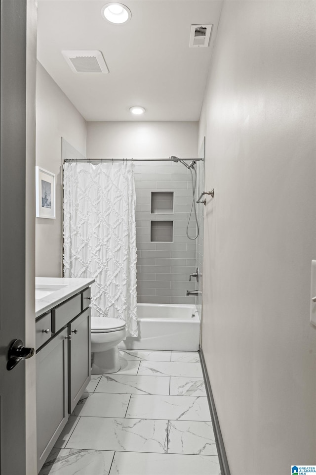 full bathroom with vanity, shower / bath combination with curtain, and toilet