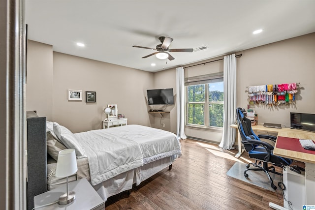 bedroom with wood-type flooring and ceiling fan