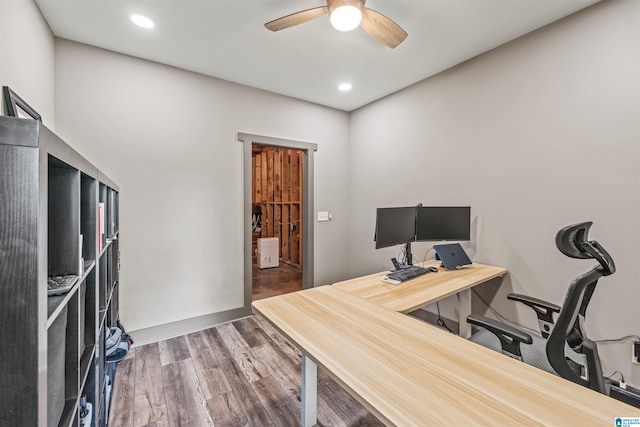 home office featuring ceiling fan and dark hardwood / wood-style flooring