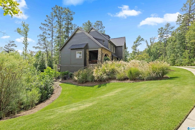 view of property exterior with a yard