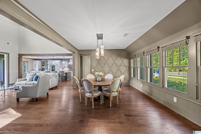 dining space with dark hardwood / wood-style floors