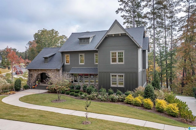 craftsman-style house with a front lawn