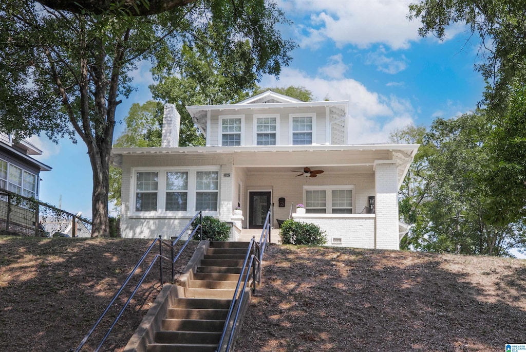 view of front of home with ceiling fan and covered porch