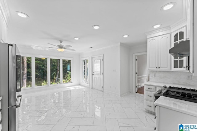 kitchen featuring stainless steel fridge, exhaust hood, ceiling fan, decorative backsplash, and white cabinets