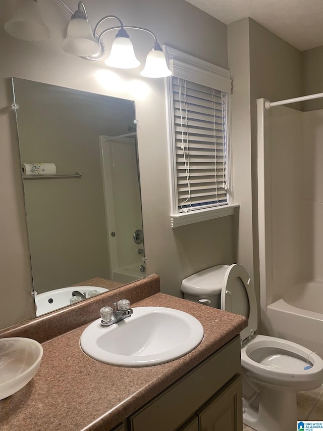 full bathroom featuring shower / bathtub combination, toilet, and vanity