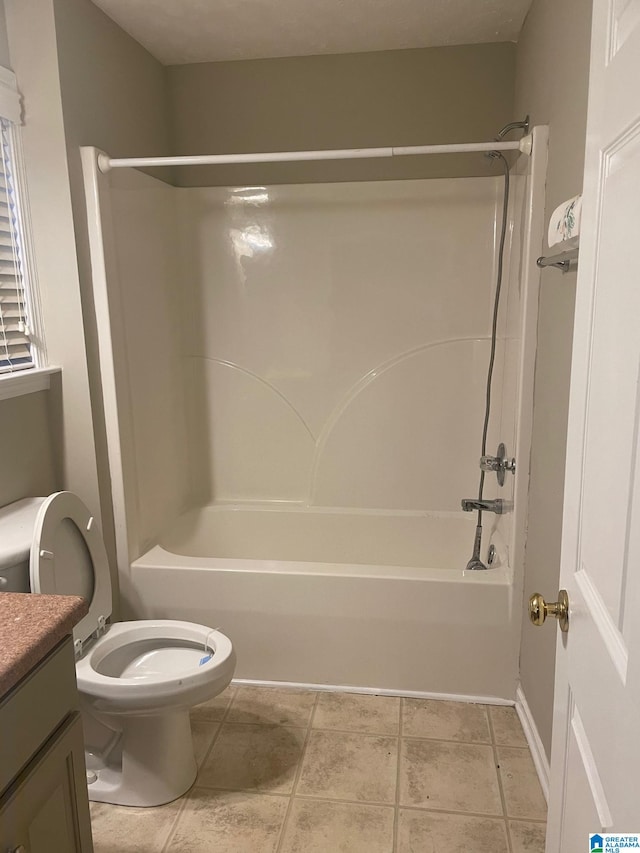 full bathroom featuring tile patterned flooring, toilet, shower / bathing tub combination, and vanity