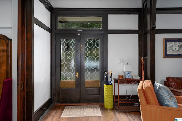foyer with french doors and wood finished floors