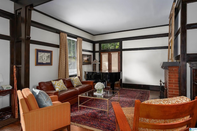 living room featuring hardwood / wood-style flooring and a brick fireplace