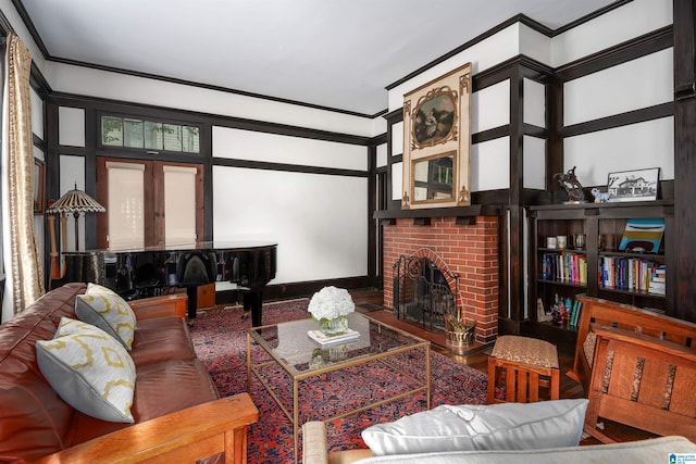 living room with crown molding and a brick fireplace