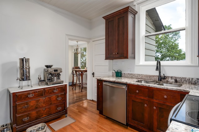 kitchen featuring dishwasher, light hardwood / wood-style flooring, light stone counters, and sink