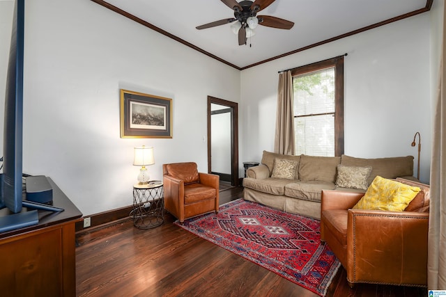 living room with crown molding, dark hardwood / wood-style flooring, and ceiling fan