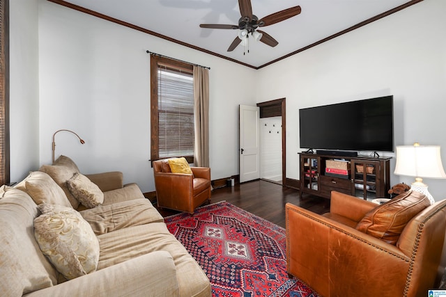 living room with ornamental molding, dark wood-type flooring, and ceiling fan