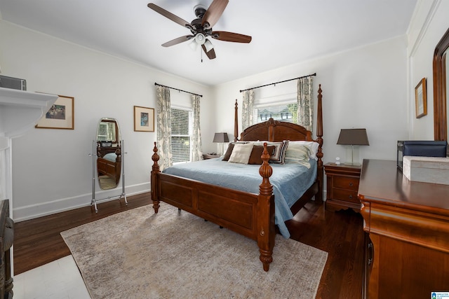 bedroom with ceiling fan and dark hardwood / wood-style flooring