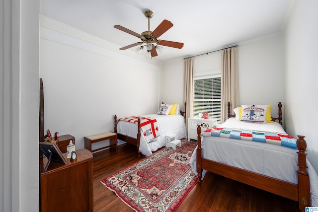 bedroom with crown molding, ceiling fan, and dark hardwood / wood-style flooring