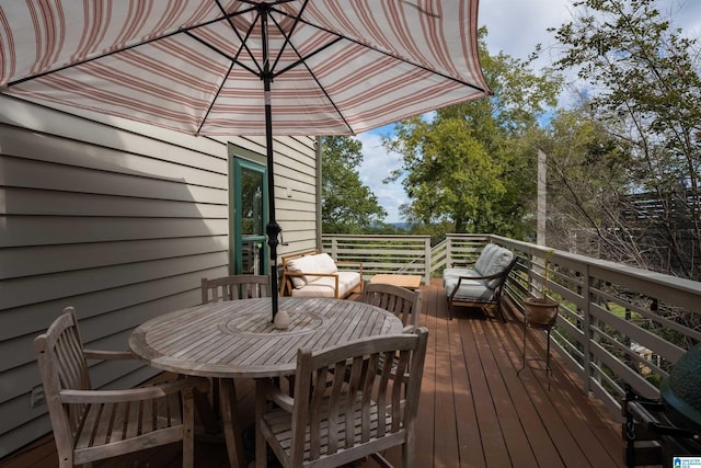 wooden deck with outdoor dining space