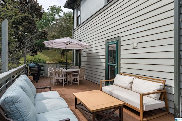 wooden terrace featuring an outdoor living space and outdoor dining space