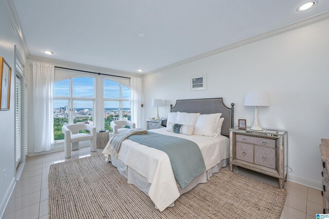 bedroom featuring ornamental molding and light tile patterned floors