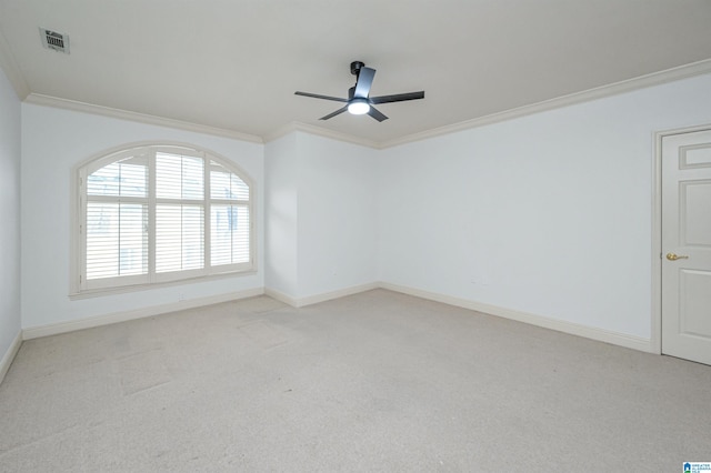 unfurnished room featuring crown molding, light carpet, and ceiling fan