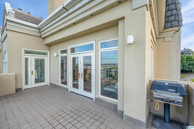 view of patio with a grill and french doors