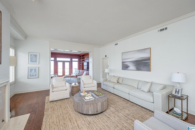 living room featuring ornamental molding, french doors, and hardwood / wood-style flooring