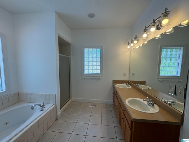 bathroom with vanity, plus walk in shower, and tile patterned floors