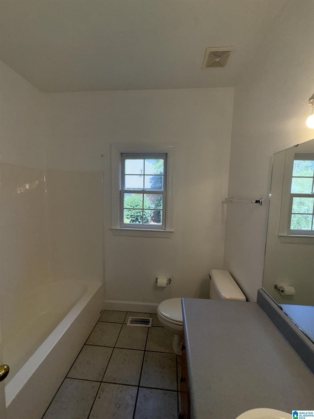 bathroom with tile patterned floors, vanity, baseboards, toilet, and visible vents