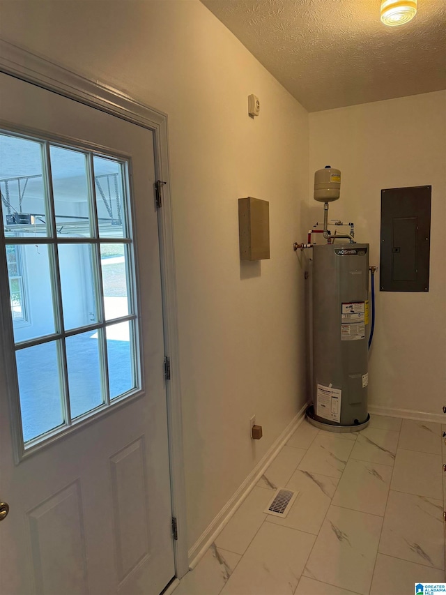 utility room featuring water heater and electric panel