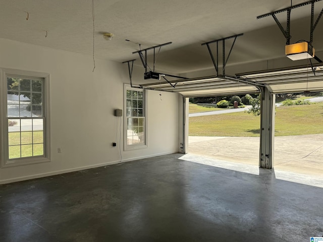 garage featuring baseboards and a garage door opener