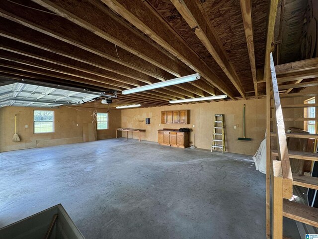 miscellaneous room featuring concrete floors and a garage