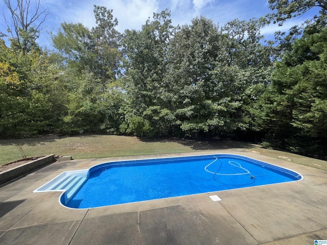 outdoor pool featuring a patio
