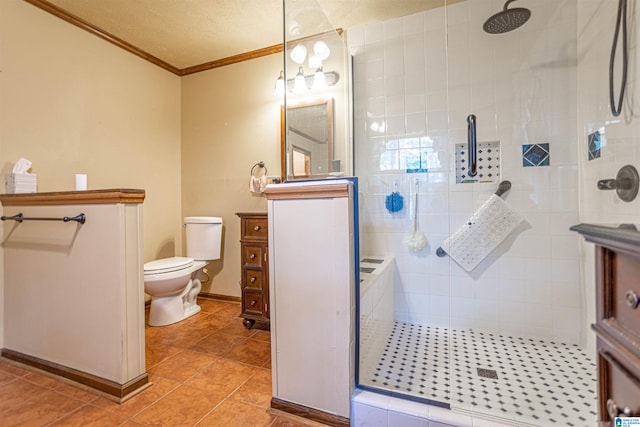 bathroom featuring a textured ceiling, tile patterned floors, toilet, a tile shower, and vanity