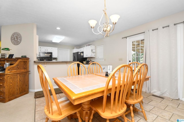 dining space featuring a chandelier