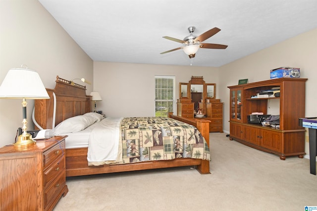 bedroom with light colored carpet and ceiling fan