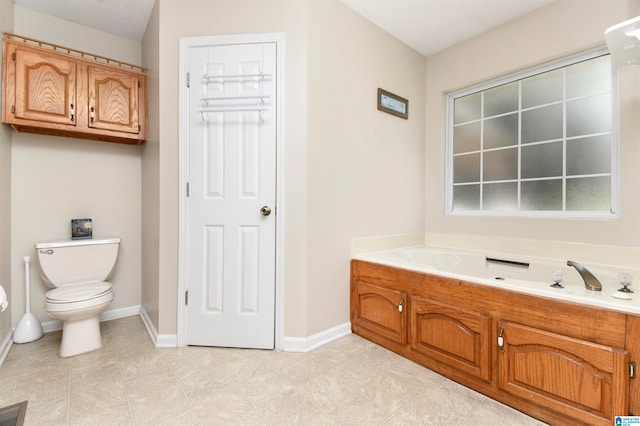 bathroom featuring toilet and a washtub