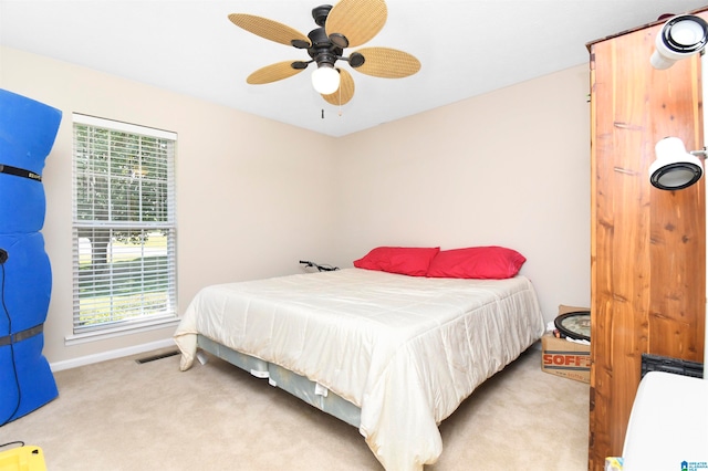 carpeted bedroom with ceiling fan