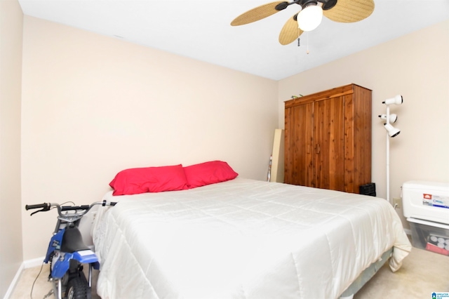 bedroom with ceiling fan and carpet flooring