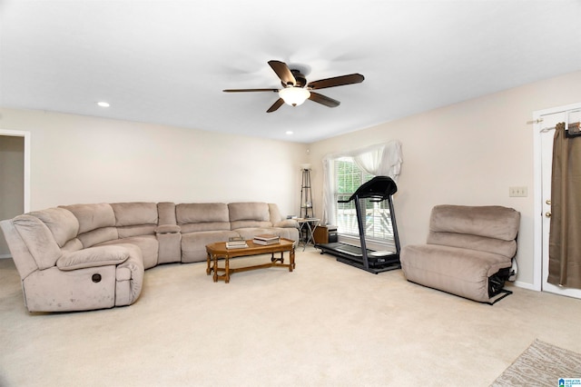 carpeted living room featuring ceiling fan