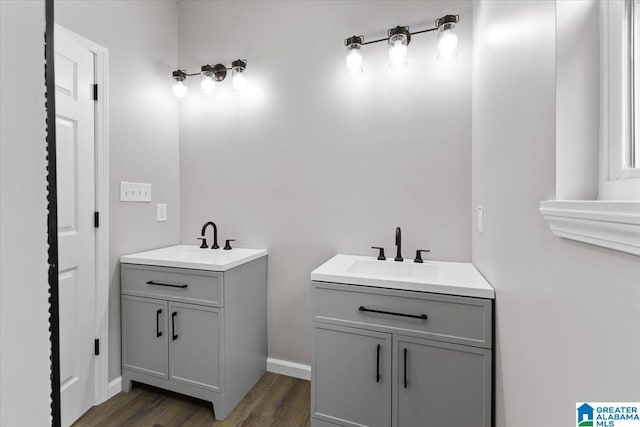 bathroom with hardwood / wood-style floors and vanity