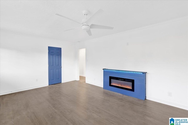 unfurnished living room featuring ornamental molding, dark wood-type flooring, and ceiling fan