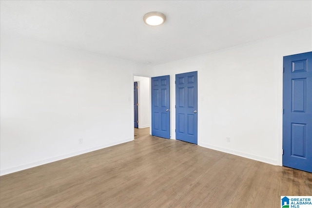 spare room with light hardwood / wood-style floors