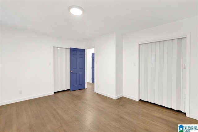 unfurnished bedroom with light hardwood / wood-style flooring and a closet