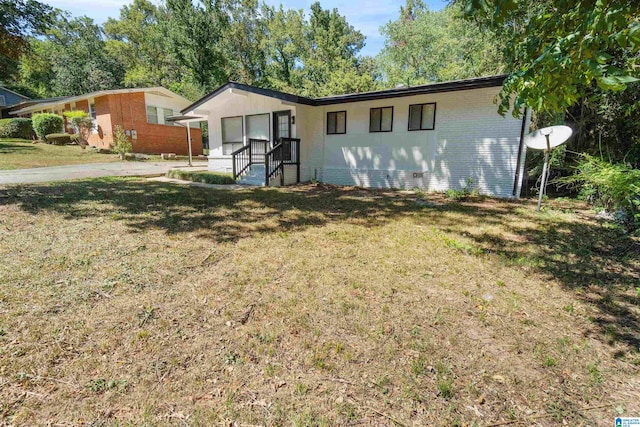 exterior space featuring a lawn